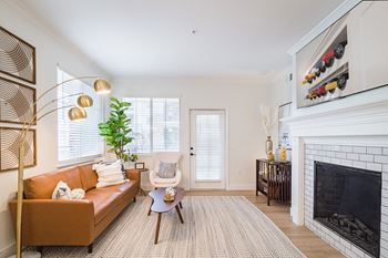 A living room with a couch and fireplace